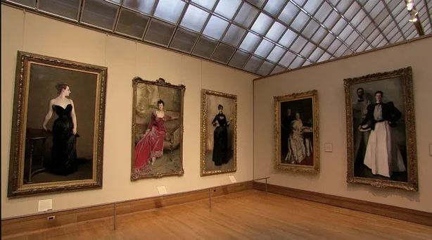 An image of a museum showcsing different old-age paintings