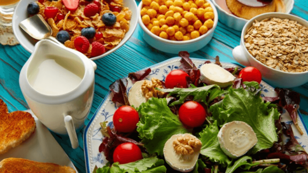 A picture of multiple food dishes including vegetables, milk, fruits etc.